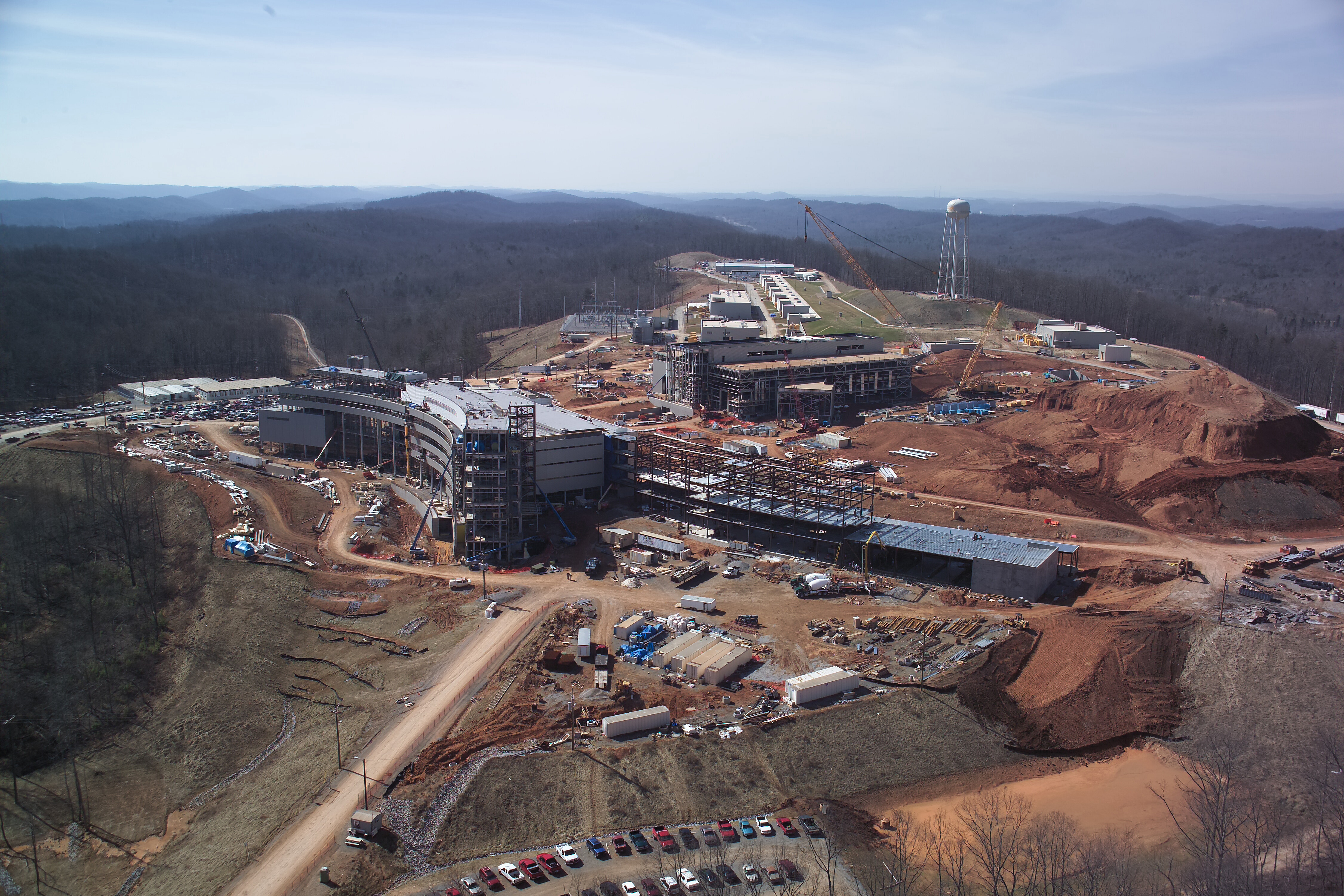 The SNS site in 2004, where major construction was under way on the SNS target building, central lab offices, and (center) the adjacent wing of the Center for Nanophase Materials Sciences user facility. (Credit: ORNL/Curtis Boles) 