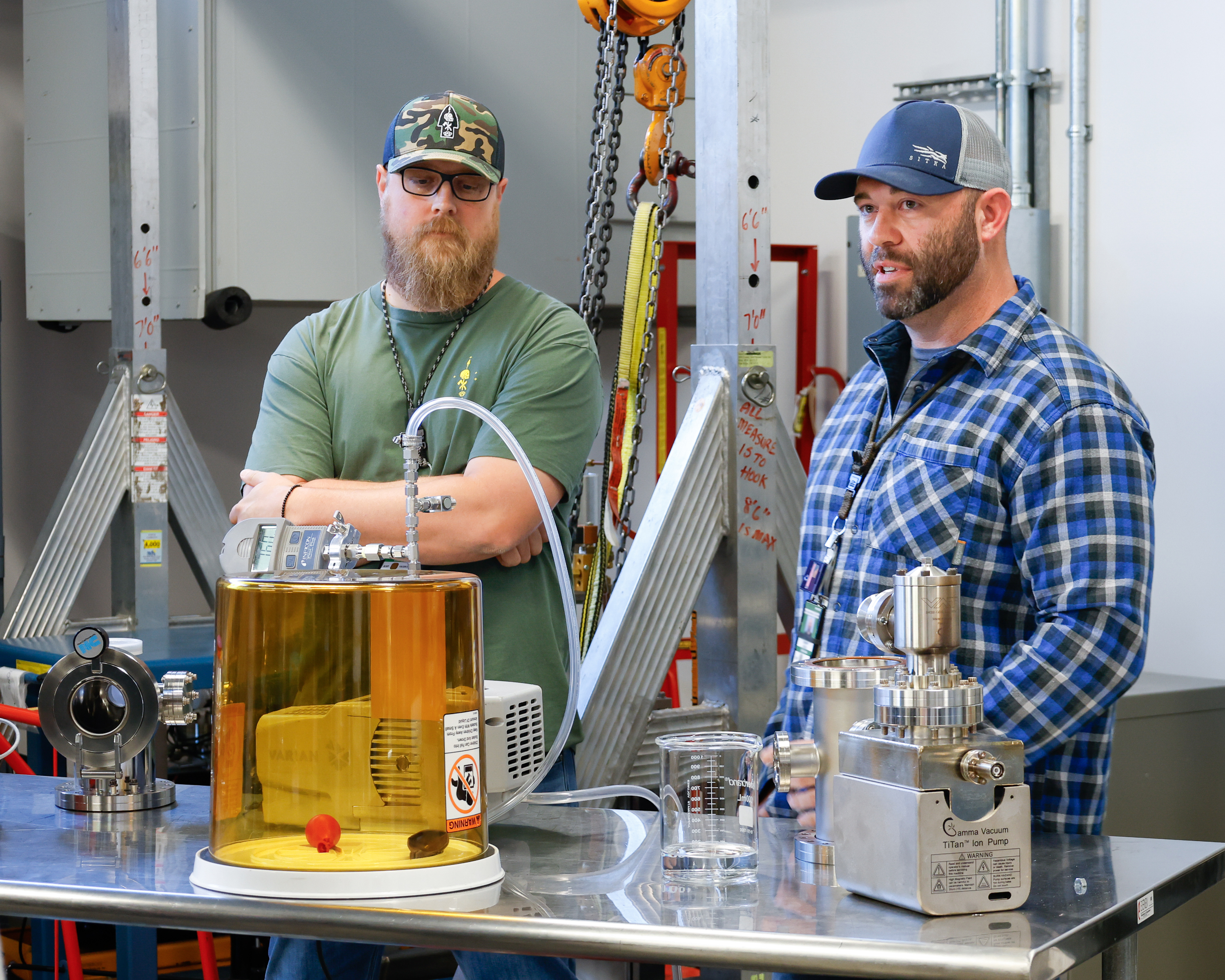 Jeremy Price and Jacob Cole demonstrate an experiment for a group of students visiting SNS. (Photo Credit: Carol Morgan/ORNL, U.S. Dept. of Energy)