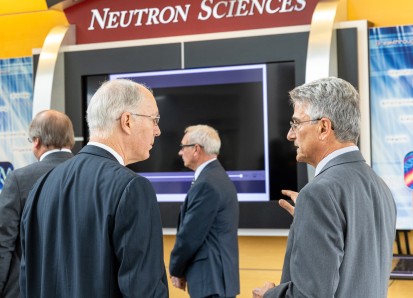 John Galambos (right) talks about neutron science with Illinois Congressman Bill Foster in 2019 at t
