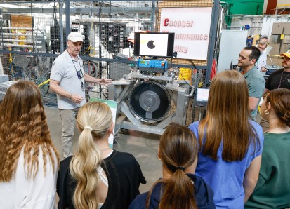 Jerry Stockton, Group Leader for Neutron Choppers, presents to a group of students at one of the sev
