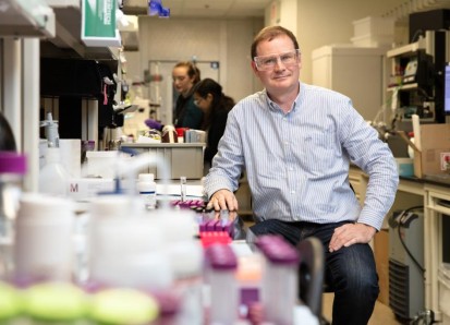 Hugh O'Neil, director or ORNL's Center for Structural Molecular Biology is sitting in the lab on a s