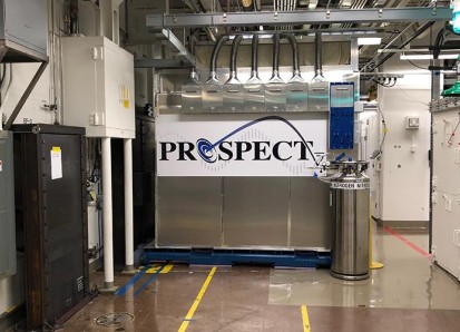 The PROSPECT neutrino detector in a lab at Oak Ridge National Laboratory, with pipes overhead and a