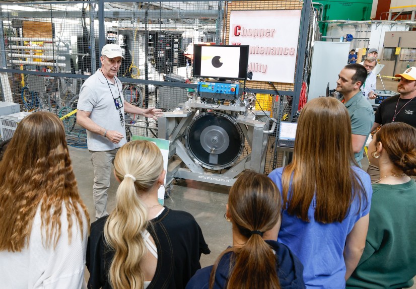 Jerry Stockton, Group Leader for Neutron Choppers, presents to a group of students at one of the sev