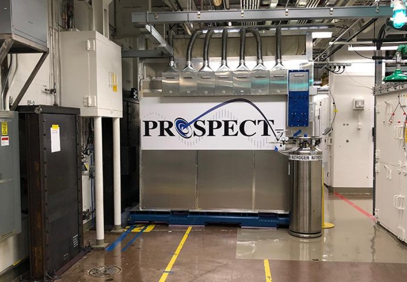 The PROSPECT neutrino detector in a lab at Oak Ridge National Laboratory, with pipes overhead and a 