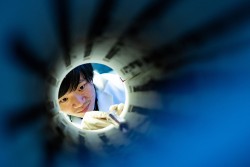 Rice University graduate student Lebing Chen spent three months perfecting a recipe for making flat sheets of chromium triiodide, a two-dimensional quantum material that appears to be a “magnetic topological insulator.” (Photo by Jeff Fitlow/Rice University)
