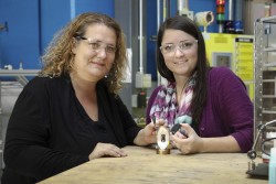 ORNL’s Bianca Haberl and Amy Elliott hold 3D-printed collimators — an invention that has been licensed to ExOne, a leading binder jet 3D printer company. Credit: Genevieve Martin/Oak Ridge National Laboratory, U.S. Dept. of Energy