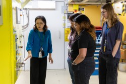 Scientist shows students the TOPAZ instrument at ORNL