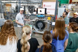 Jerry Stockton, Group Leader for Neutron Choppers, presents to a group of students at one of the sev