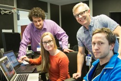 Shown here are Emil Bozin (standing, left) from Brookhaven National Laboratory, Sandra Skjærvø and Sverre Magnus Selbach (both seated) from the Norwegian University of Science and Technology, and Simon Billinge of Columbia Univ. and Brookhaven (standing, right) reviewing real time data at the NOMAD instrument hutch, SNS beam line 1B. Image credit: Genevieve Martin/ORNL