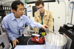 UT researchers Zhili Zhang (left) and Cary Smith, in association with researchers from the US Air Force, use neutrons at HFIR’s CG-1D instrument to investigate fluid flow dynamics for potentially improved fuel systems in hypersonic vehicles and other industrial spray-related applications. (Image credit: ORNL/Genevieve Martin)