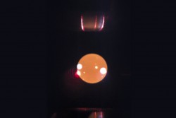 A sample suspended mid-air at about 1400°K with the Neutron Electrostatic Levitator at the Cold Neutron Chopper Spectrometer. Photo Credit: ORNL/Dante Quirinale