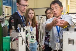 A group of NXS 2016 students learns about neutron triple-axis spectrometry from Instrument Scientist Songxue Chi. Image credit: Genevieve Martin/ORNL