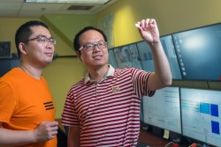 University of Nebraska-Lincoln researchers Xiang Zhang (left) and Prof. Bai Cui use neutron diffraction to study the microstructure and residual stress characterizations of additively manufactured ceramic materials. (Credit: ORNL/Carlos Jones) 
