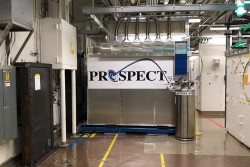 The PROSPECT neutrino detector in a lab at Oak Ridge National Laboratory, with pipes overhead and a 