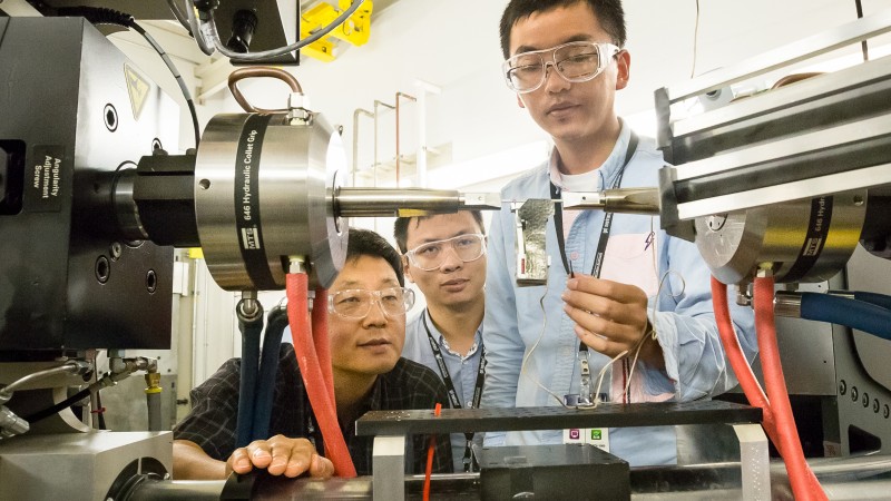 Dr. Dongchul Chae from POSCO, Yuan Li and Peijun Hou from the University of Tennessee, Knoxville, adjust a sample of stainless steel they are studying at VULCAN, SNS beam line 7. 