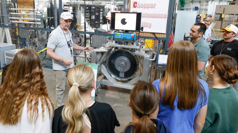 Jerry Stockton, Group Leader for Neutron Choppers, presents to a group of students at one of the sev