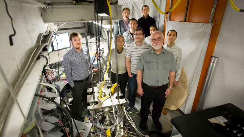 A group of researchers is using neutrons to study the atomic dynamics of liquid metals is key to unlocking the mystery of the atomistic origin of viscosity. From left to right are Adam Vogt (ORNL), Takeshi Egami (UTK, JINS), Robert Ashcraft (WUSTL), Chris Pueblo (WUSTL), Mark Johnson (WUSTL), Zengquan Wang (UTK), Hui Wang (UTK), Ken Kelton (WUSTL), and Konstantin Lokshin (UTK, JINS). Image credit: Genevieve Martin/ORNL. 