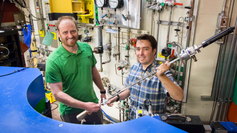 ORNL’s Andrew Christianson and Stuart Calder conducted neutron diffraction studies at the lab’s High Flux Isotope Reactor to clearly define the magnetic order of an osmium-based material. Image credit: ORNL/Genevieve Martin