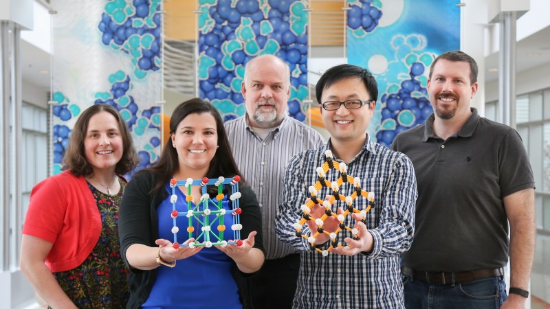 Members of the ORNL NScD collaborated to create an invited “poster” with interactive elements for EMA2017. The 3-D display showcases research on the structure of nanocrystals. From left to right, the team includes Katharine Page, Tedi-Marie Usher-Ditzian, Thomas Proffen, Jue Liu, and Daniel Olds. (Image credit: ORNL/Genevieve Martin)