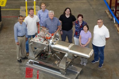 Members of the target design team pose next to the 2.0-MW-capable mercury flow target they developed.